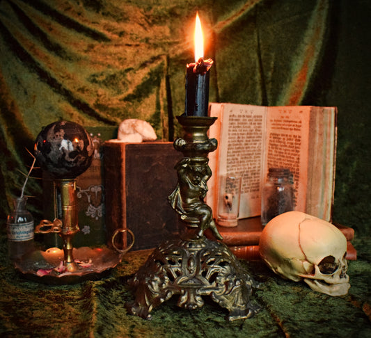 Antique cherub candle holder