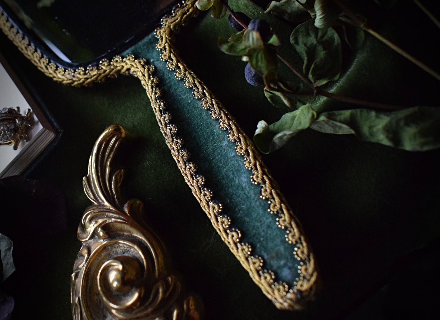 Opulent Emerald Green Hand Mirror with Gold Lace Accents